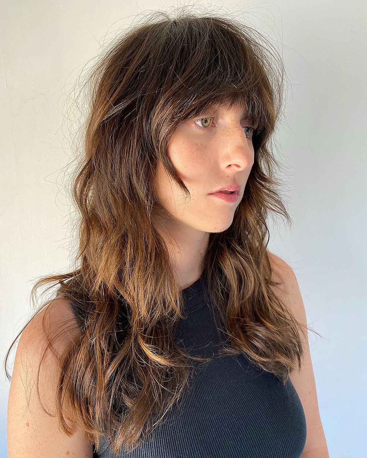 33 Greatest Ways to Pair a Wolf Cut with Bangs