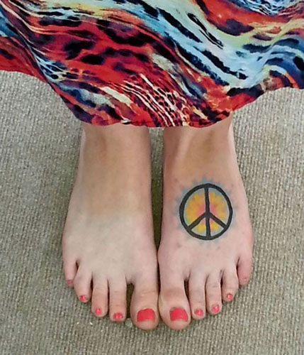 15 Best Peace Tattoo Designs to Enhance Your Beauty