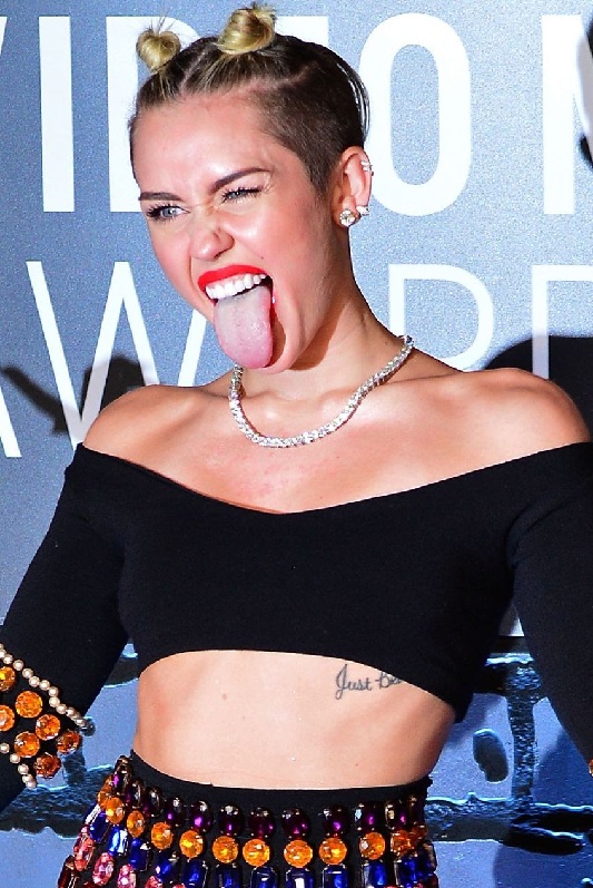 15 Best Miley Cyrus Tattoo Designs, Meanings, and Photos