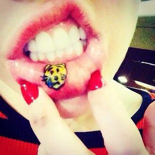 15 Best Miley Cyrus Tattoo Designs, Meanings, and Photos