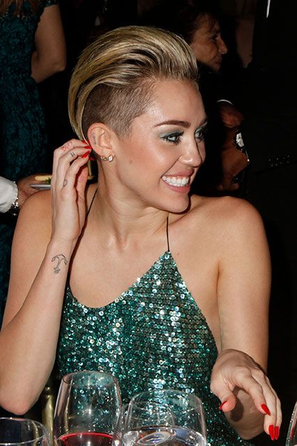 15 Best Miley Cyrus Tattoo Designs, Meanings, and Photos
