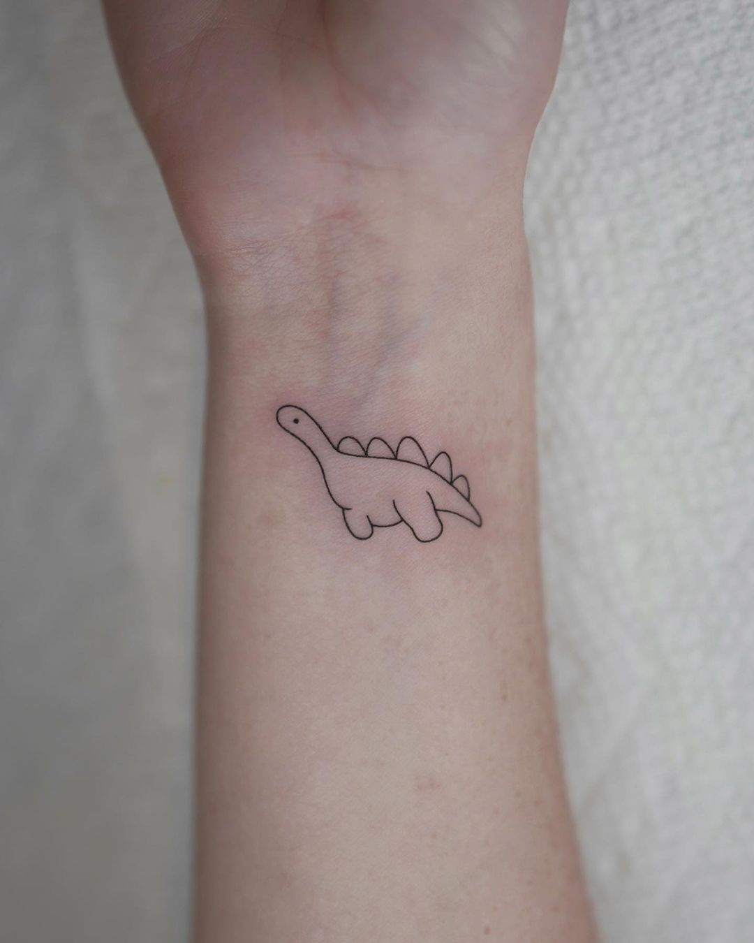 20+ Cute, Simple, and Realistic Dinosaur Tattoo Designs