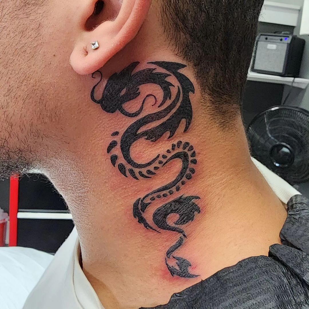 20+ Bold and Mystical Tribal Dragon Tattoo Designs