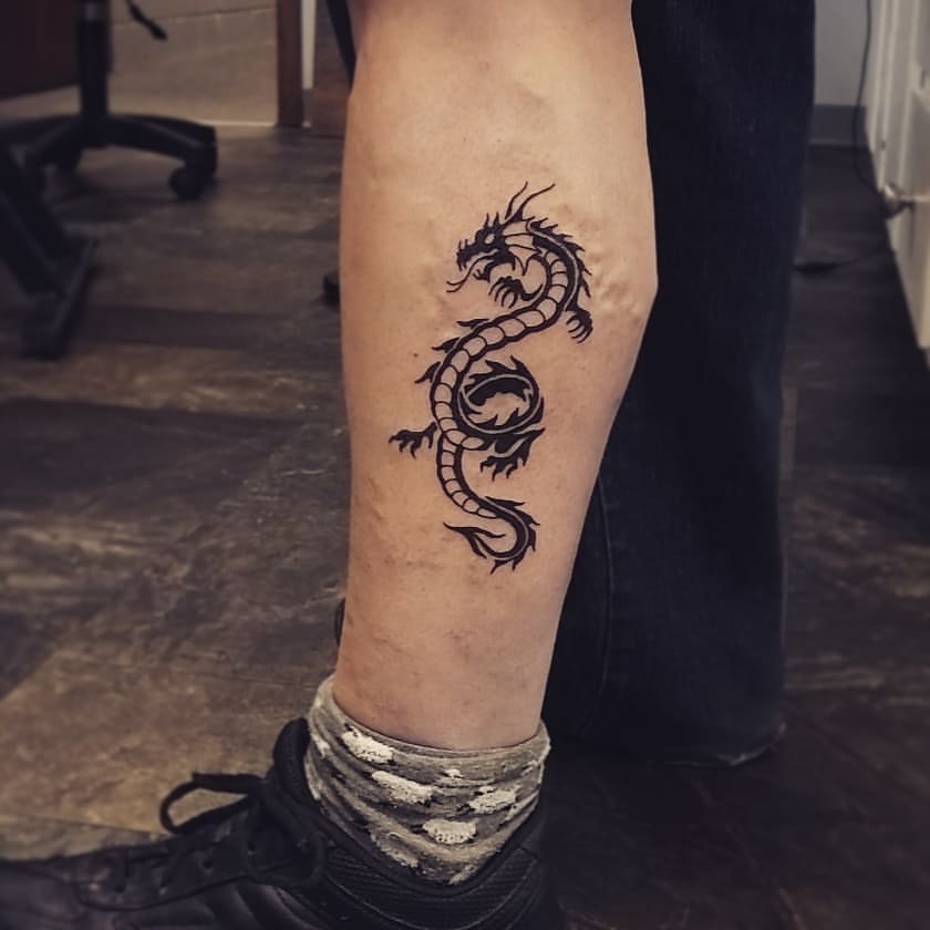 20+ Bold and Mystical Tribal Dragon Tattoo Designs