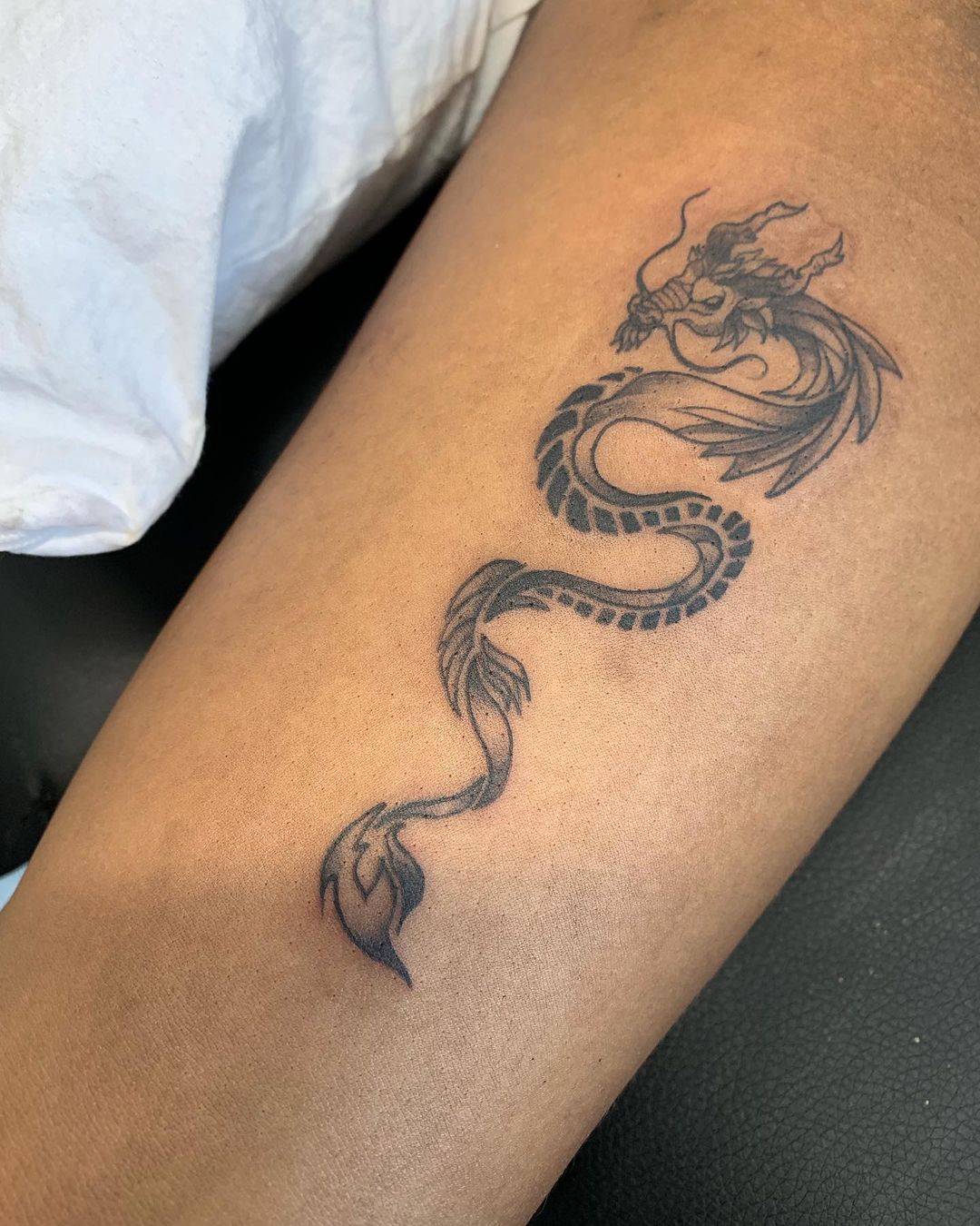 20+ Bold and Mystical Tribal Dragon Tattoo Designs