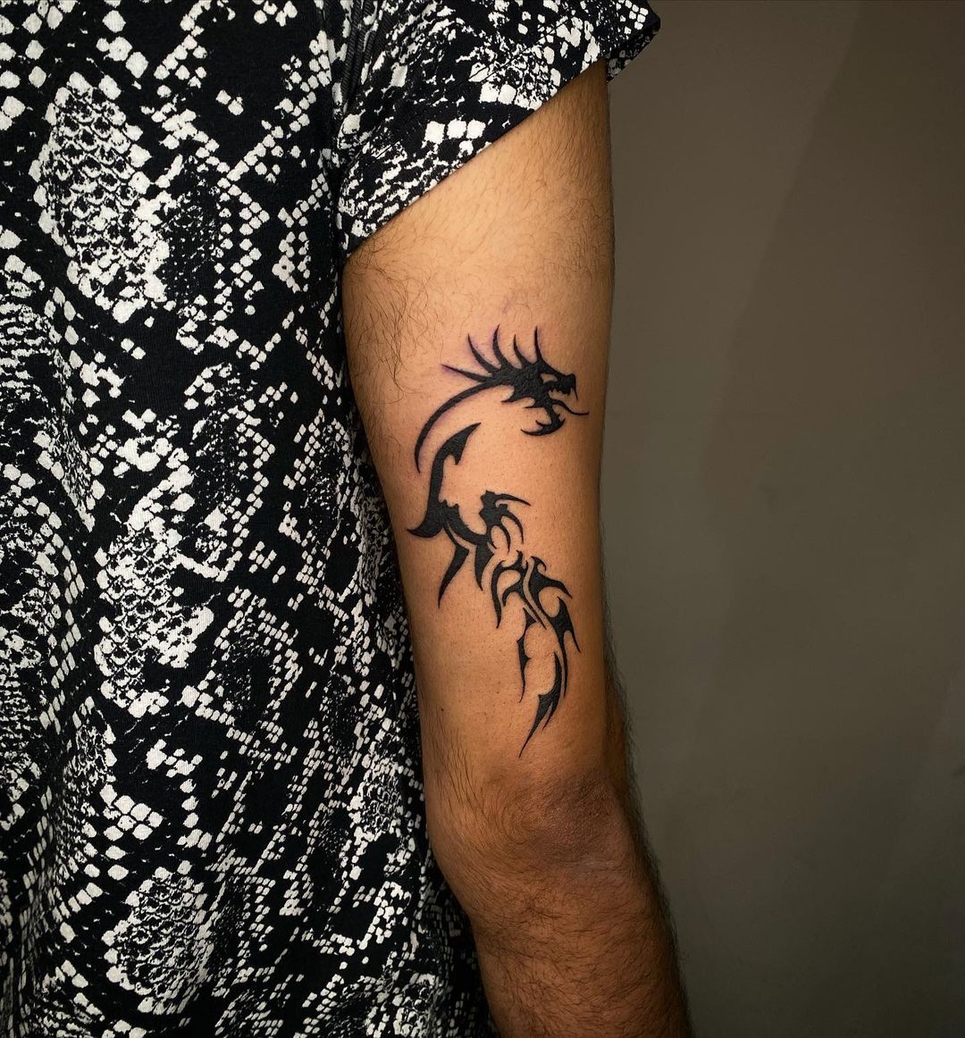 20+ Bold and Mystical Tribal Dragon Tattoo Designs